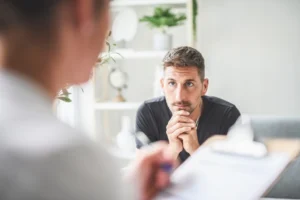 A man goes through an assessment before starting outpatient rehab.
